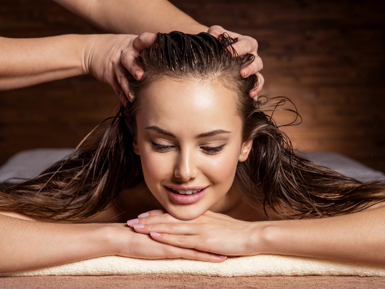 What is the best way to massage myself for a migraine?